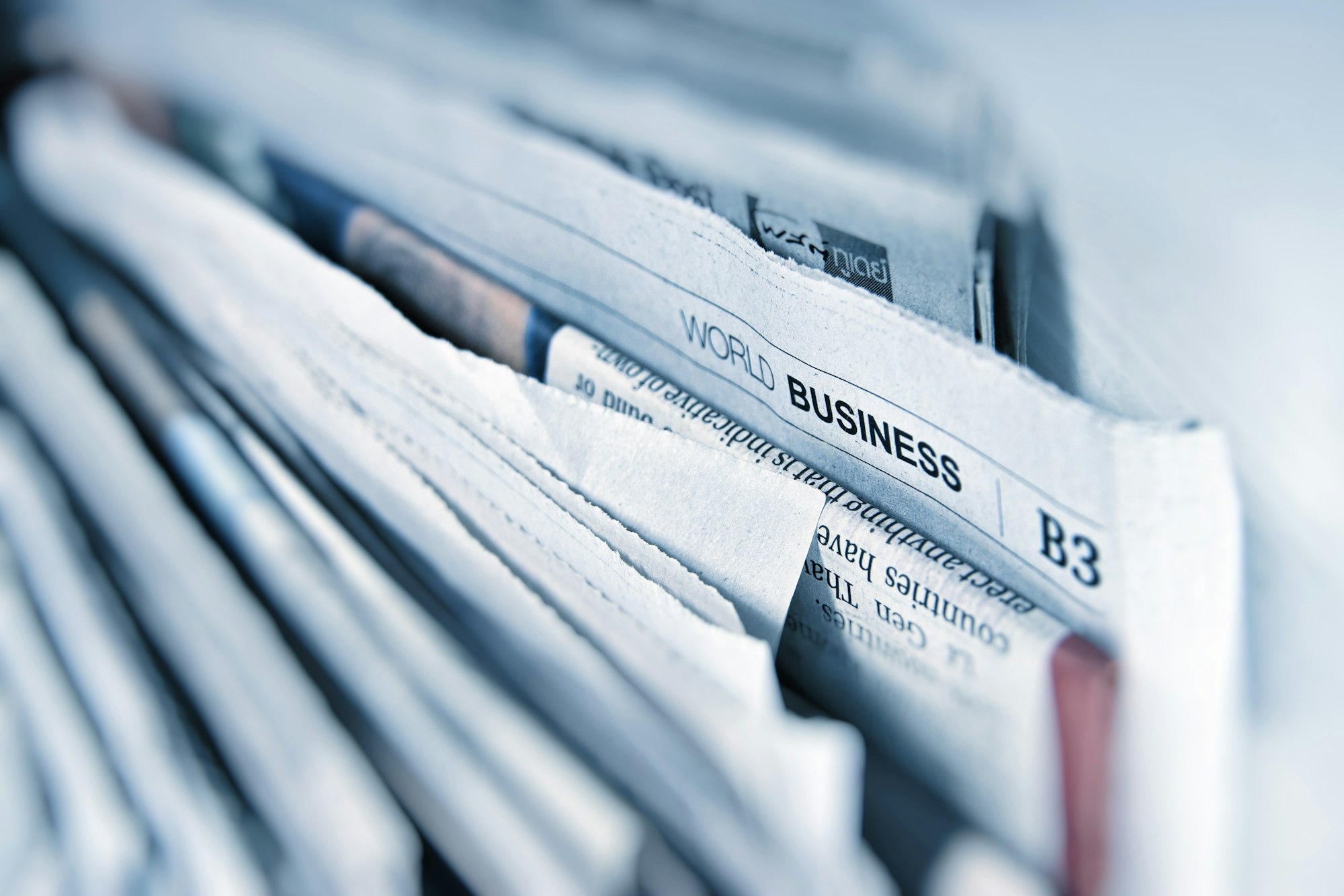 Stack of folded business newspapers